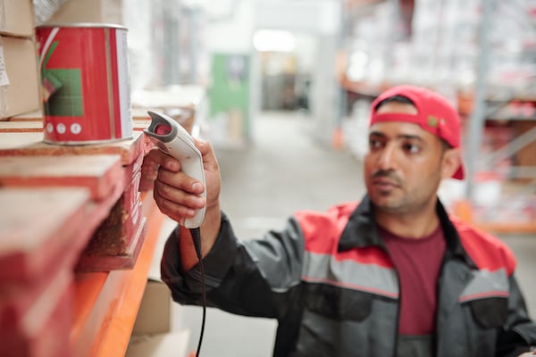 worker-of-contemporary-large-warehouse-scanning-qr-2021-09-24-03-22-55-utc